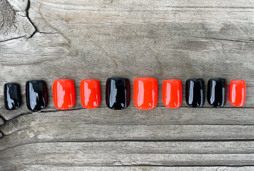Trick or Treat handmade glossy black and orange alternating halloween press on nails, short square