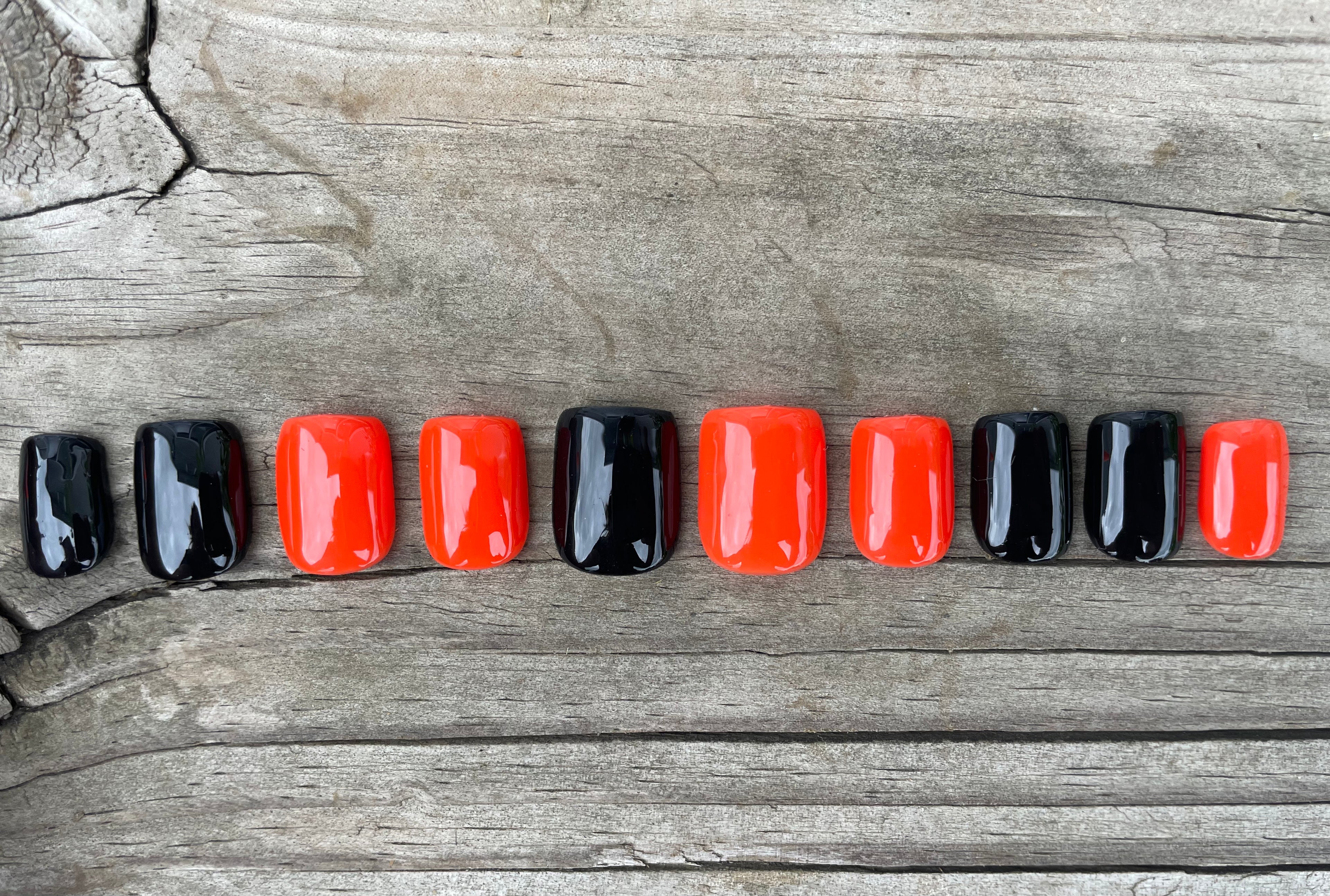 Trick or Treat handmade glossy black and orange alternating halloween press on nails, short square