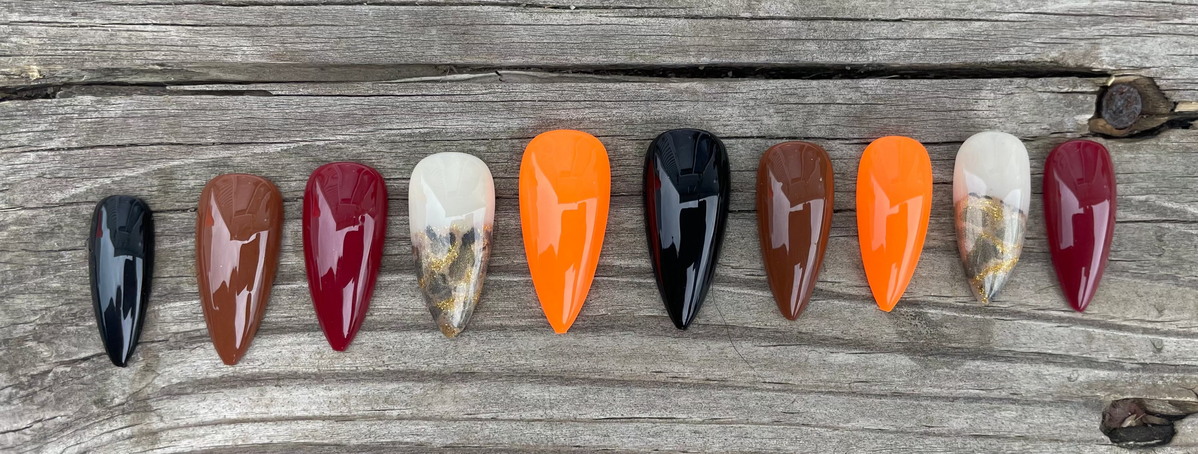 Harvest Skittles handmade fall skittle press on nails in burgundy orange brown and black with gold foil and leopard accent, stiletto, view 2