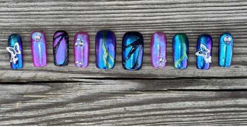 Butterfly Effect handmade iridescent chrome press on nails with butterfly charms and rhinestones